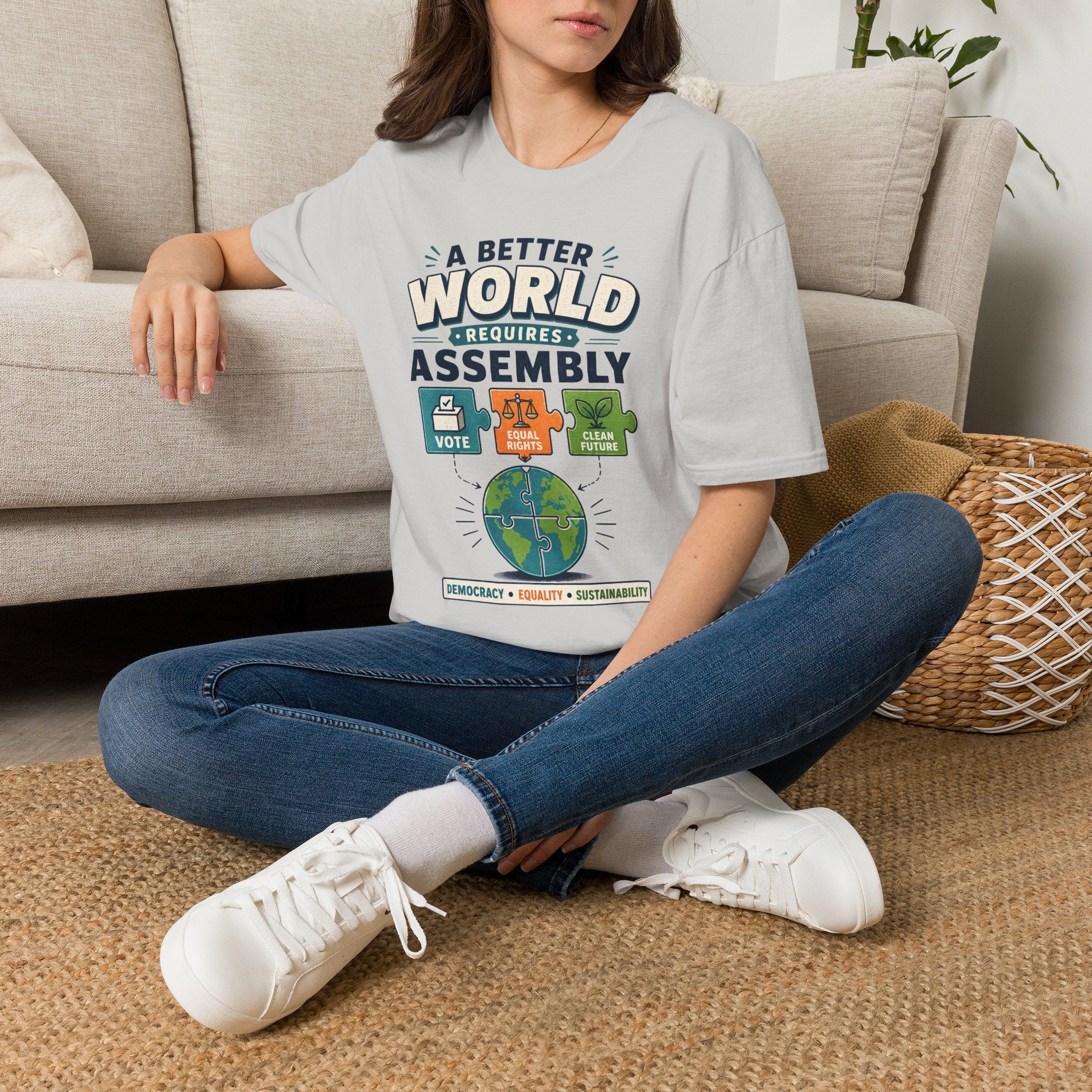 A Better World Requires Assembly T-Shirt — Sustainability, Voting & Community Graphic Tee