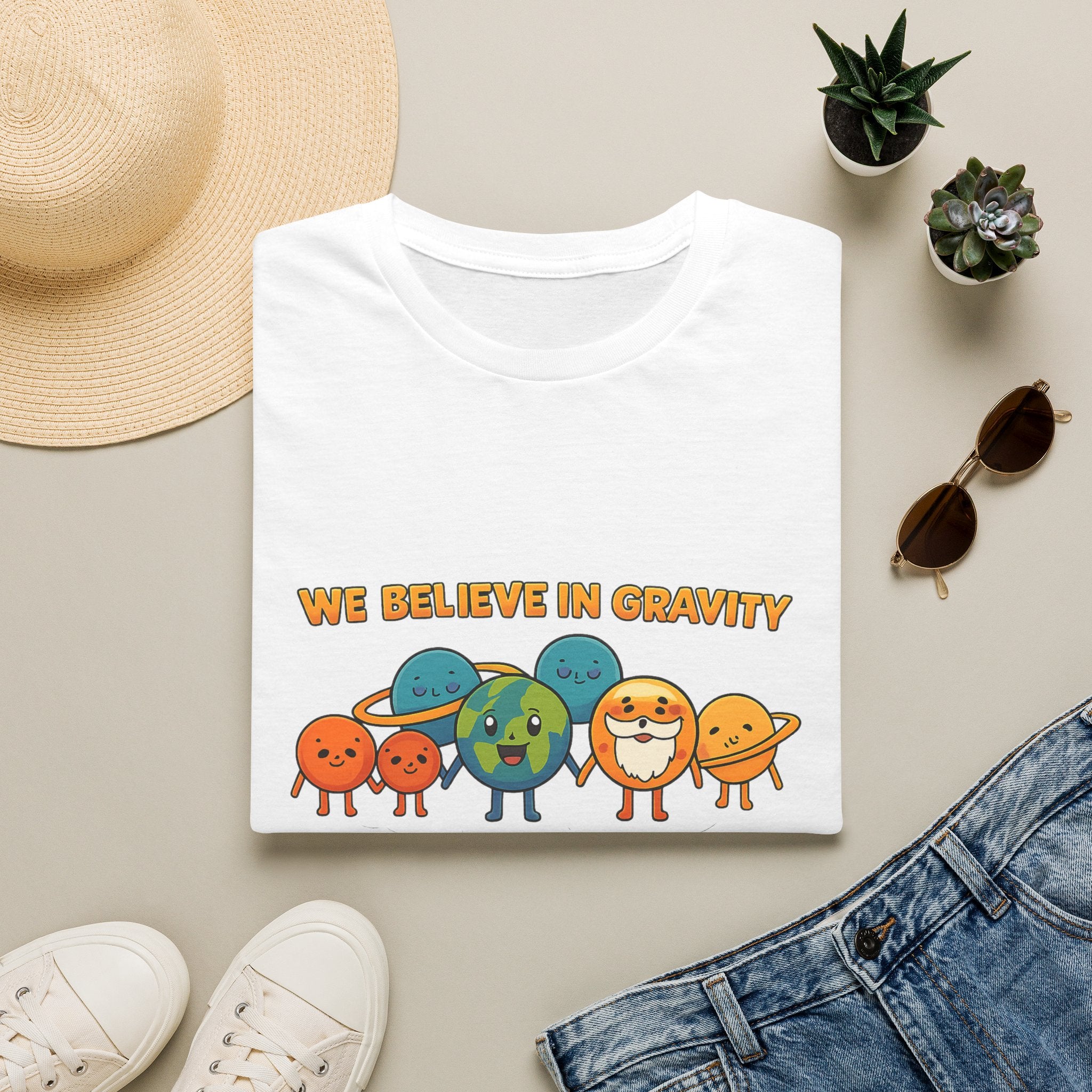 Cute Planetary Cartoon "We Believe in Gravity" Tee