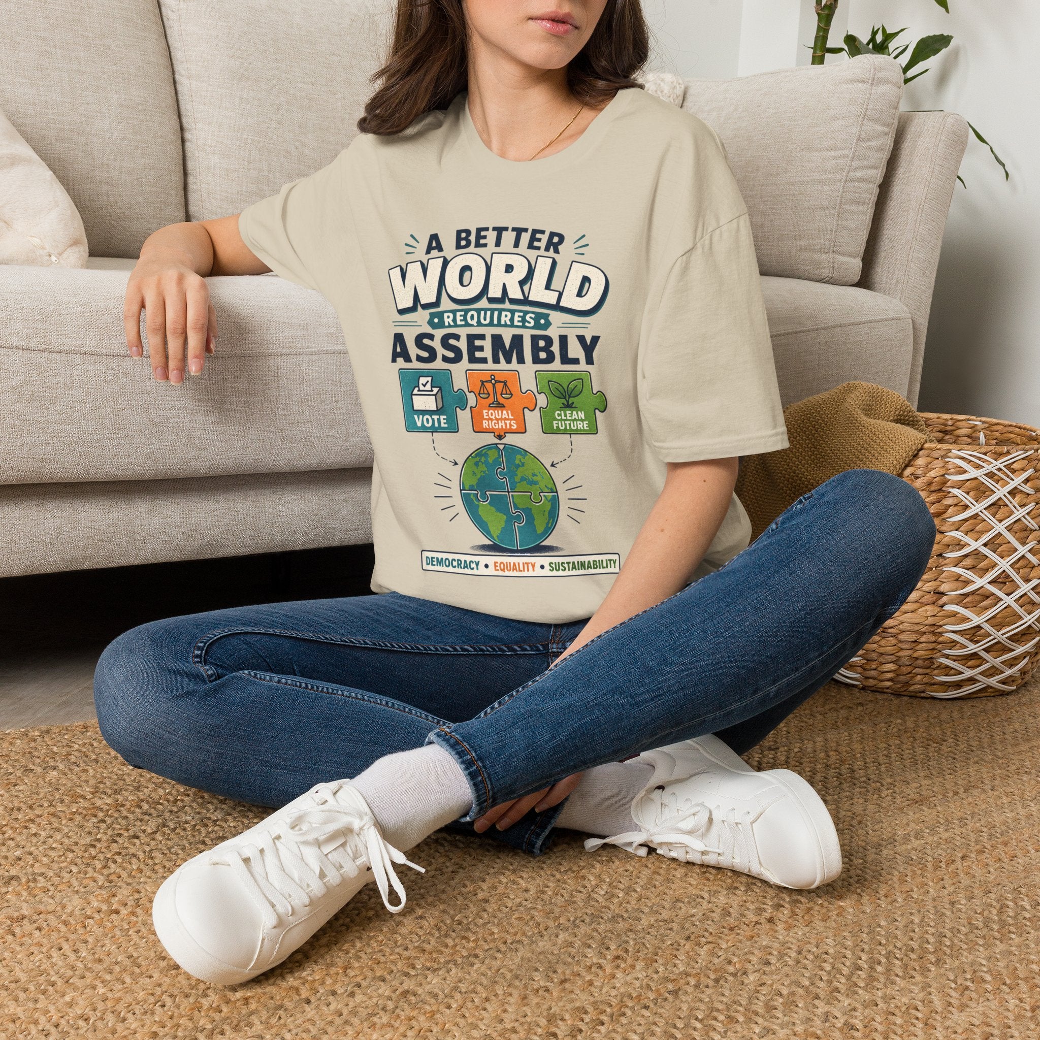 A Better World Requires Assembly T-Shirt — Sustainability, Voting & Community Graphic Tee