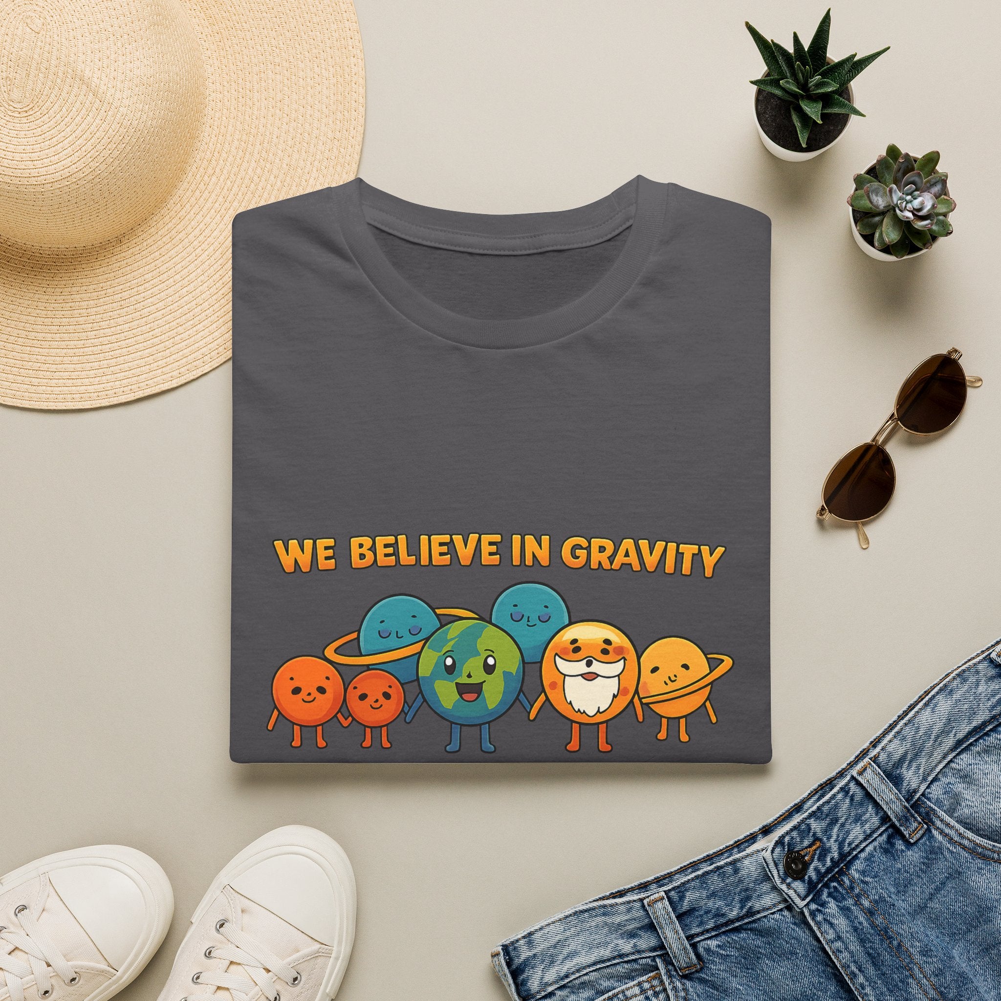 Cute Planetary Cartoon "We Believe in Gravity" Tee