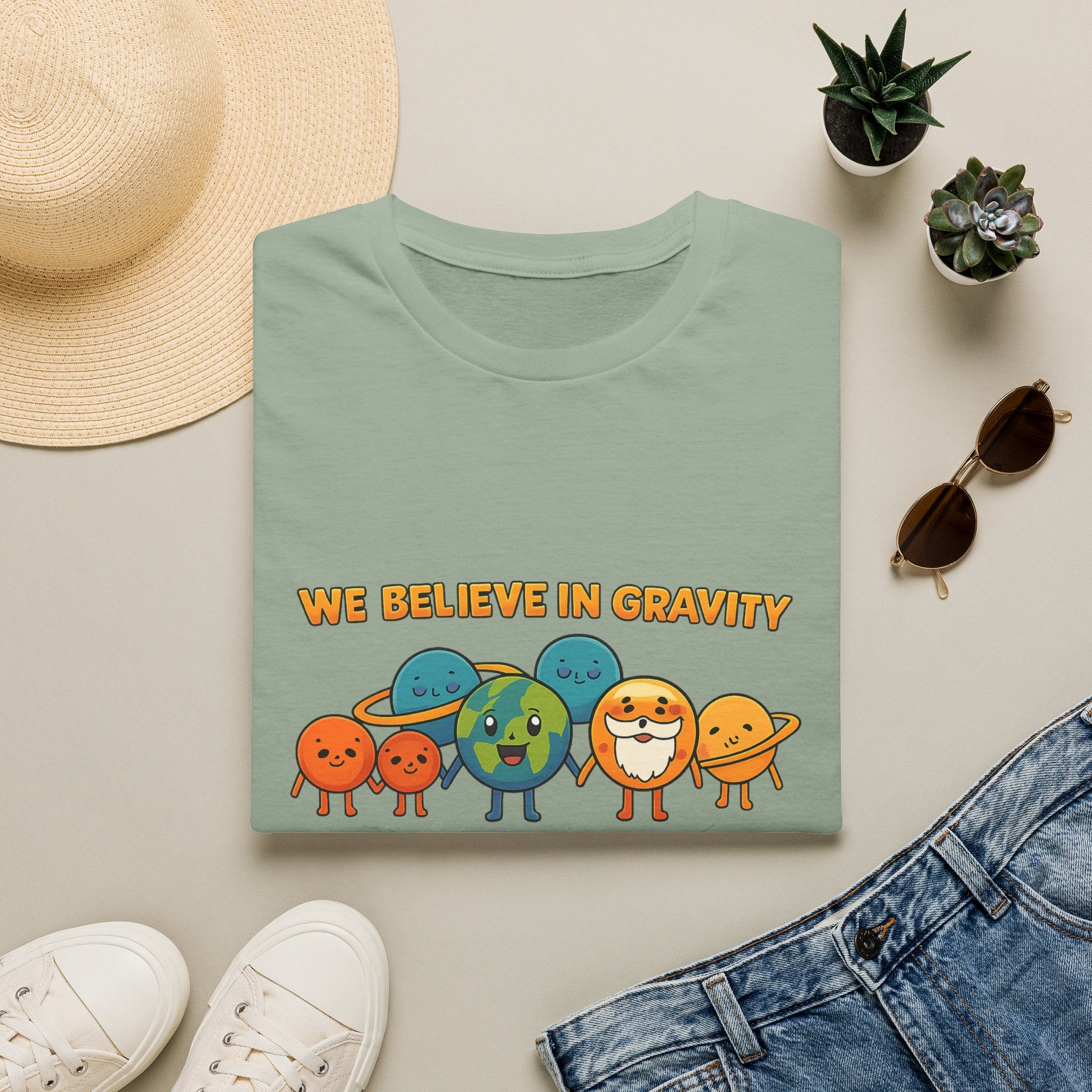 Cute Planetary Cartoon "We Believe in Gravity" Tee